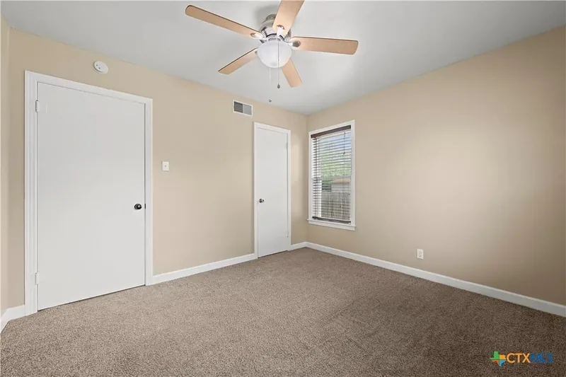 Secondary carpeted bedroom